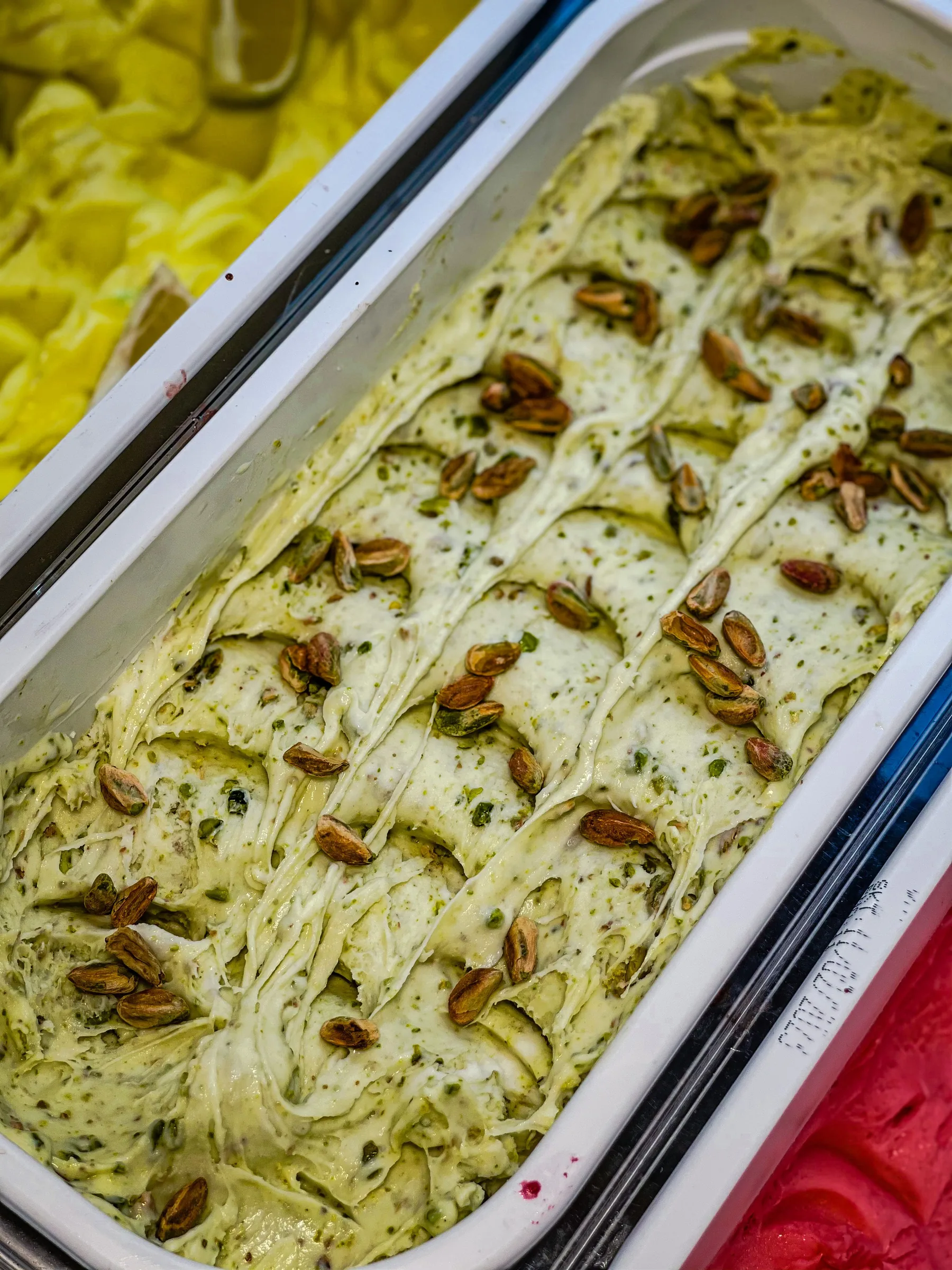 Pistachio gelato in a serving pan
